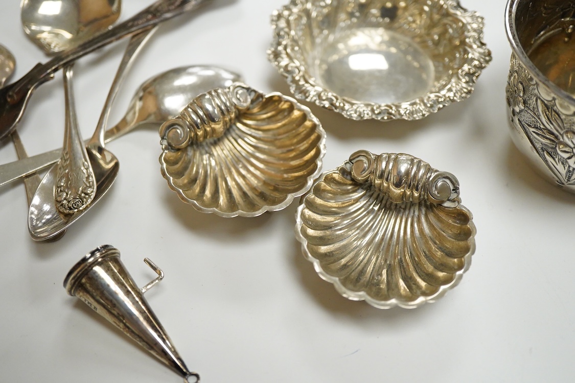 A collection of small silver, to include a late Victorian seven bar toast rack, by Edward Gilbert, London, 1887, length 13.3cm, a late Victorian bowl, pair of shell salts, nut dish, egg cup, Georgian chamberstick(part of